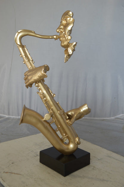 Modern art of a saxophone player resin statue -  Size: 13"L x 5"W x 25"H.