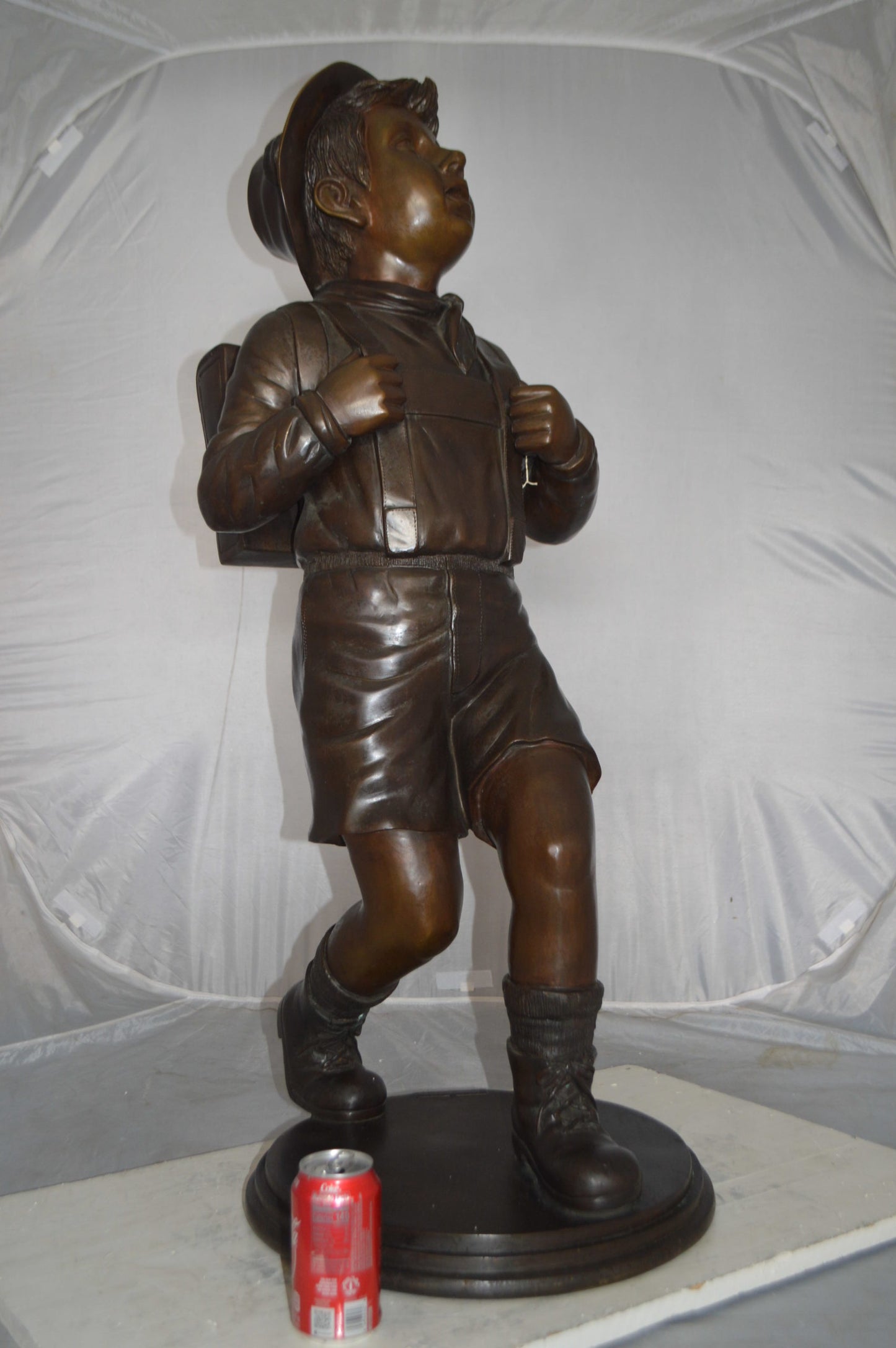 Boy with backpack bronze statue -  Size: 20"L x 18"W x 46"H.