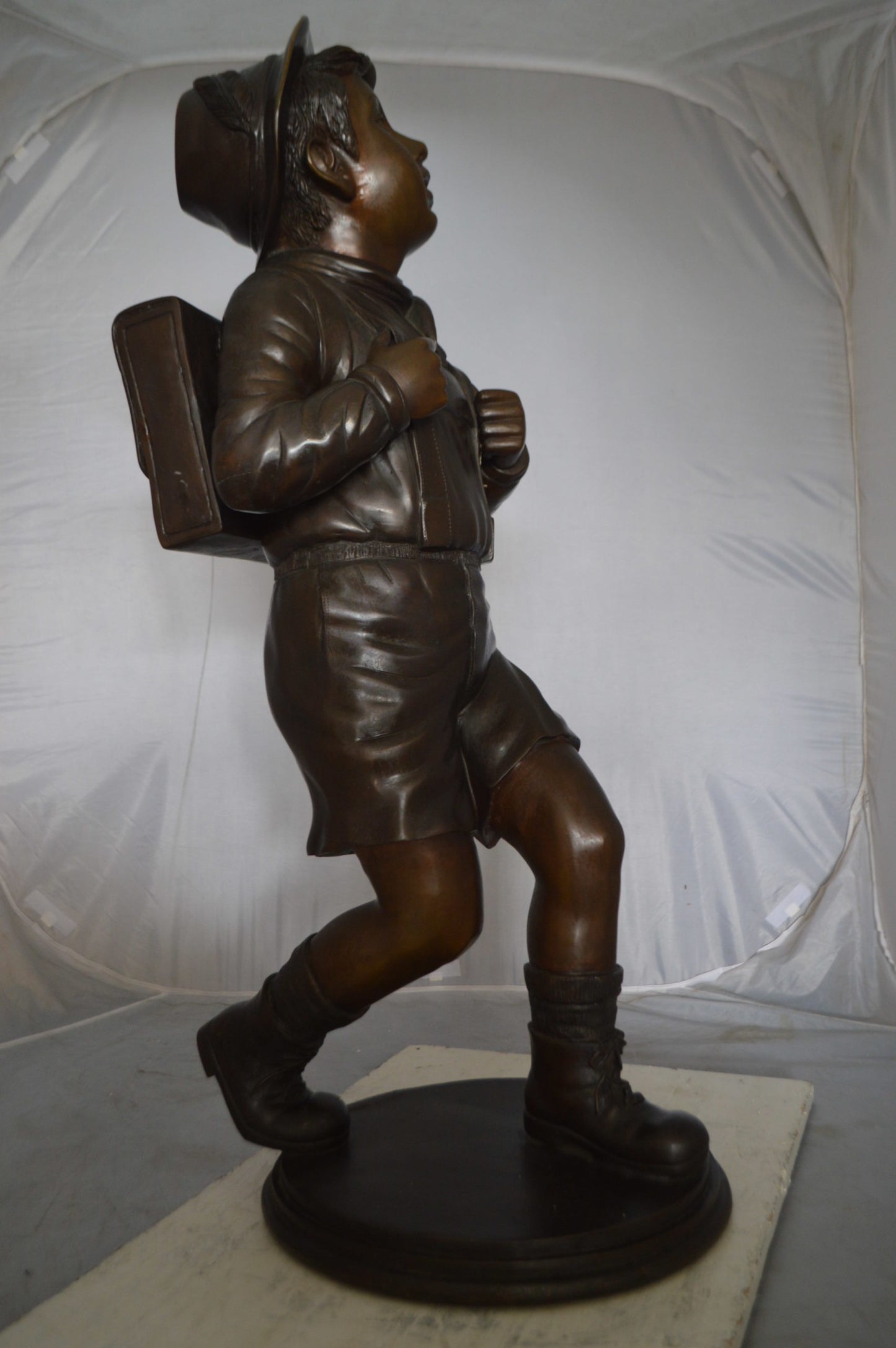Boy with backpack bronze statue -  Size: 20"L x 18"W x 46"H.