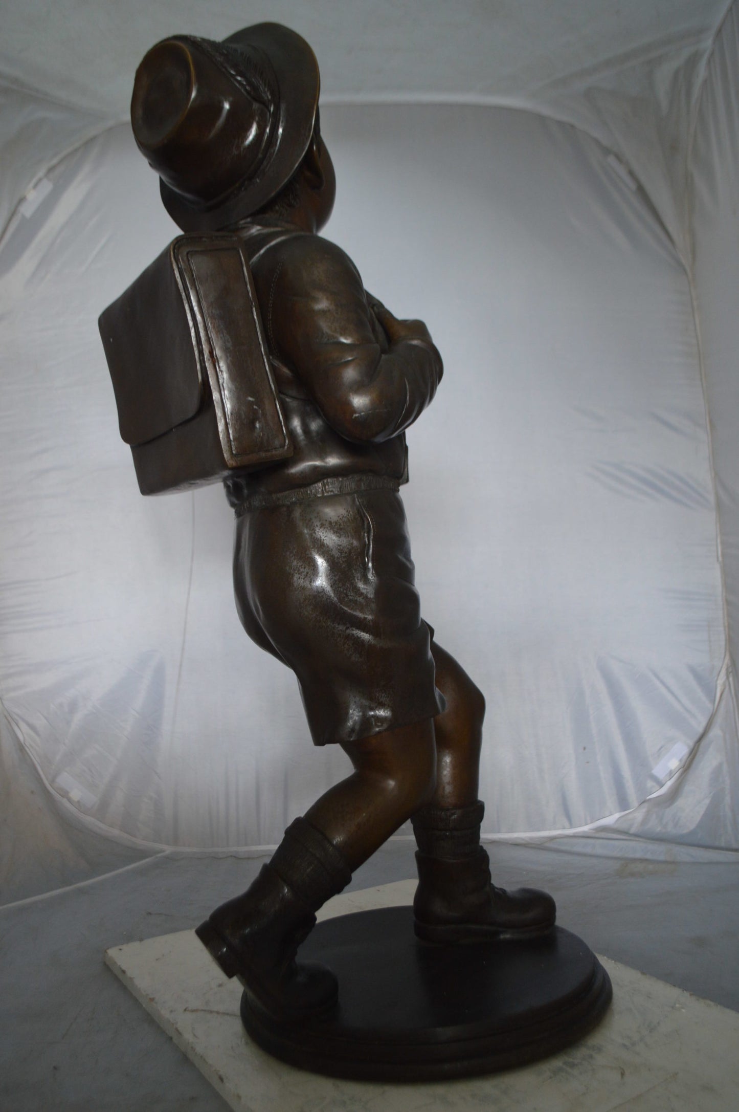 Boy with backpack bronze statue -  Size: 20"L x 18"W x 46"H.