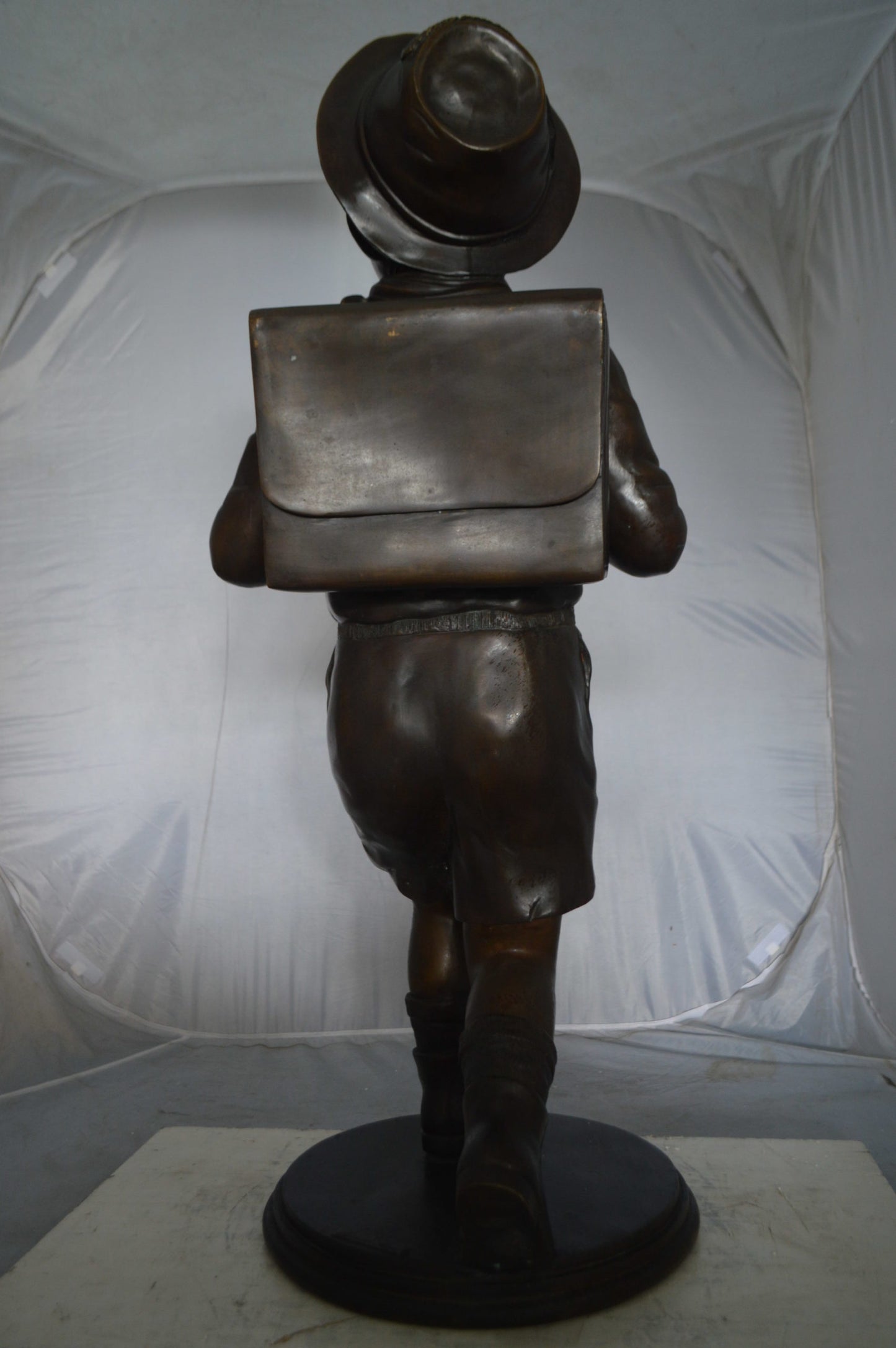Boy with backpack bronze statue -  Size: 20"L x 18"W x 46"H.