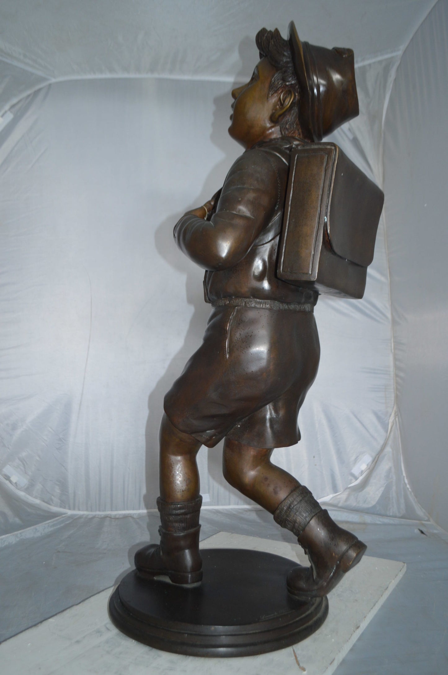 Boy with backpack bronze statue -  Size: 20"L x 18"W x 46"H.