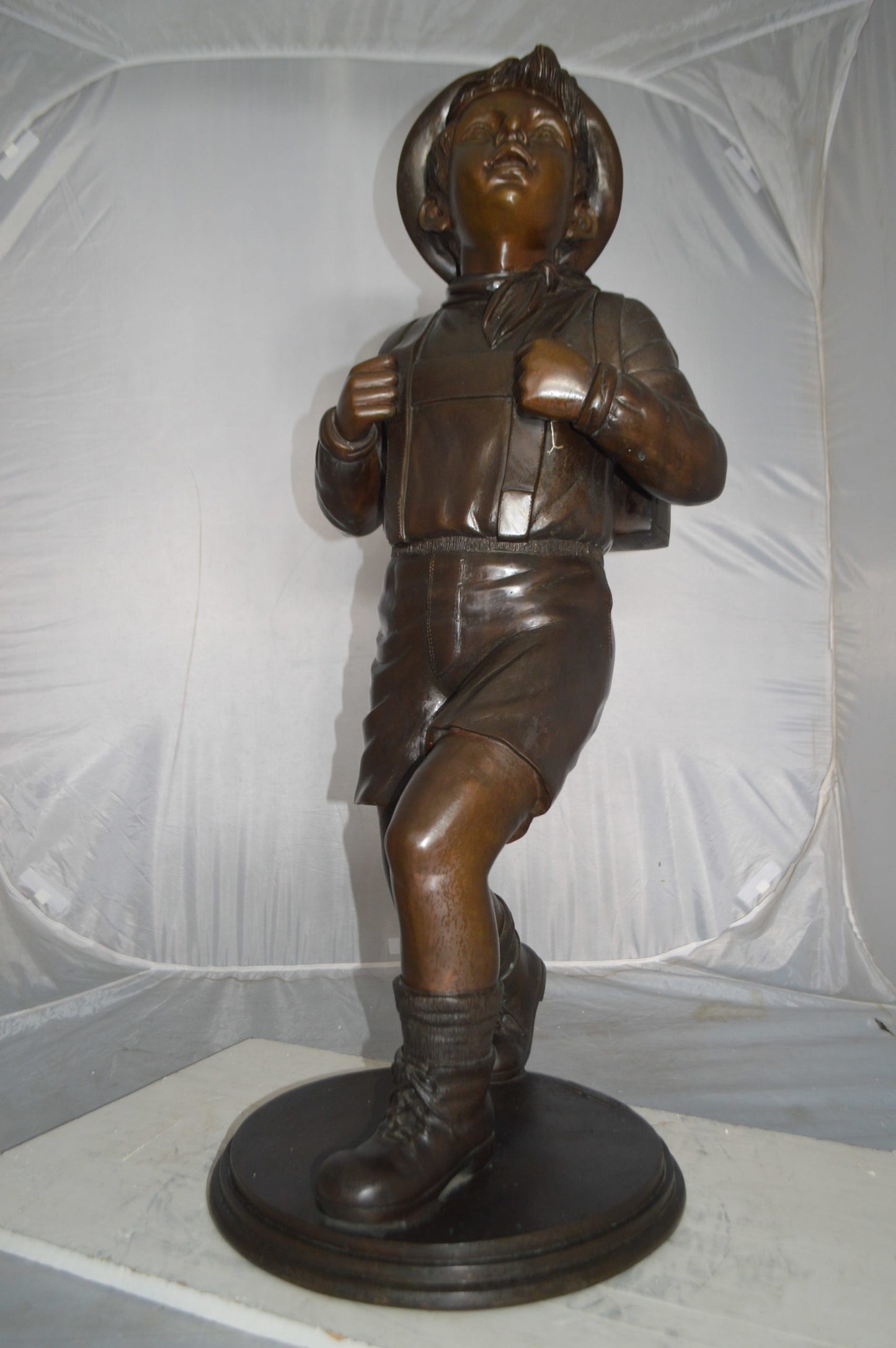 Boy with backpack bronze statue -  Size: 20"L x 18"W x 46"H.