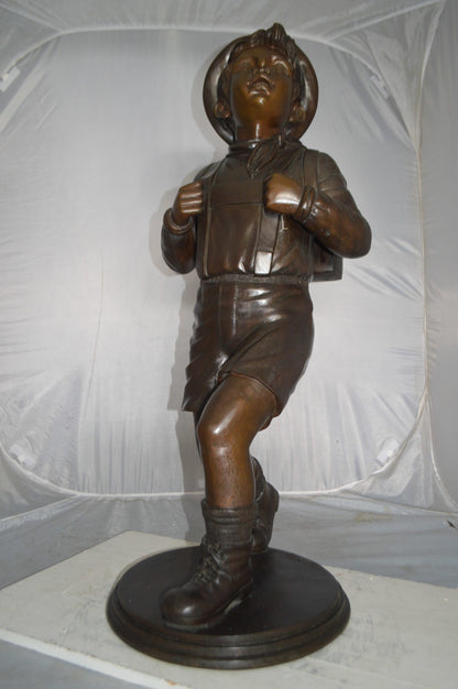 Boy with backpack bronze statue -  Size: 20"L x 18"W x 46"H.
