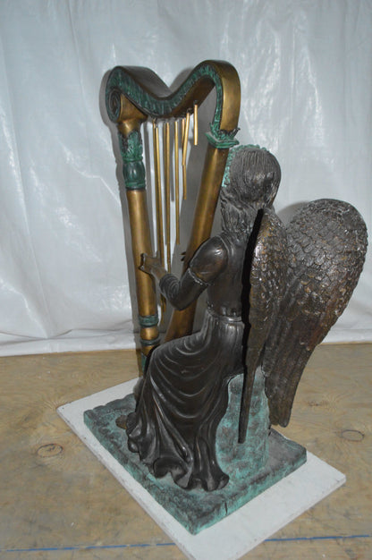 Angel playing a harp bronze statue -  Size: 30"L x 15"W x 44"H.