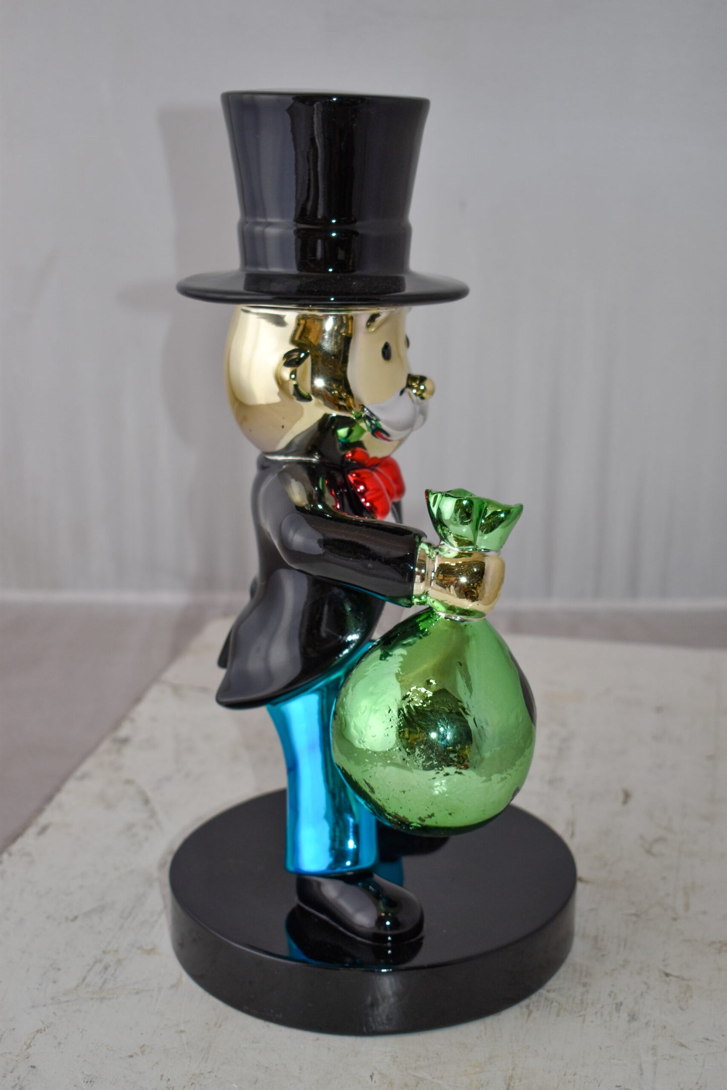 Frowning Monopoly Man Holding Money Bag Resin Statue Small Size: 7" x 8" x 15"H