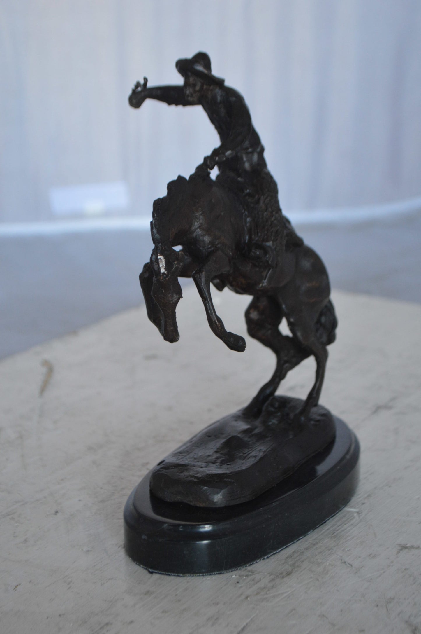 Wooly Chaps Bronze Statue by Remington 13H -  Size: 8"L x 3"W x 9"H.