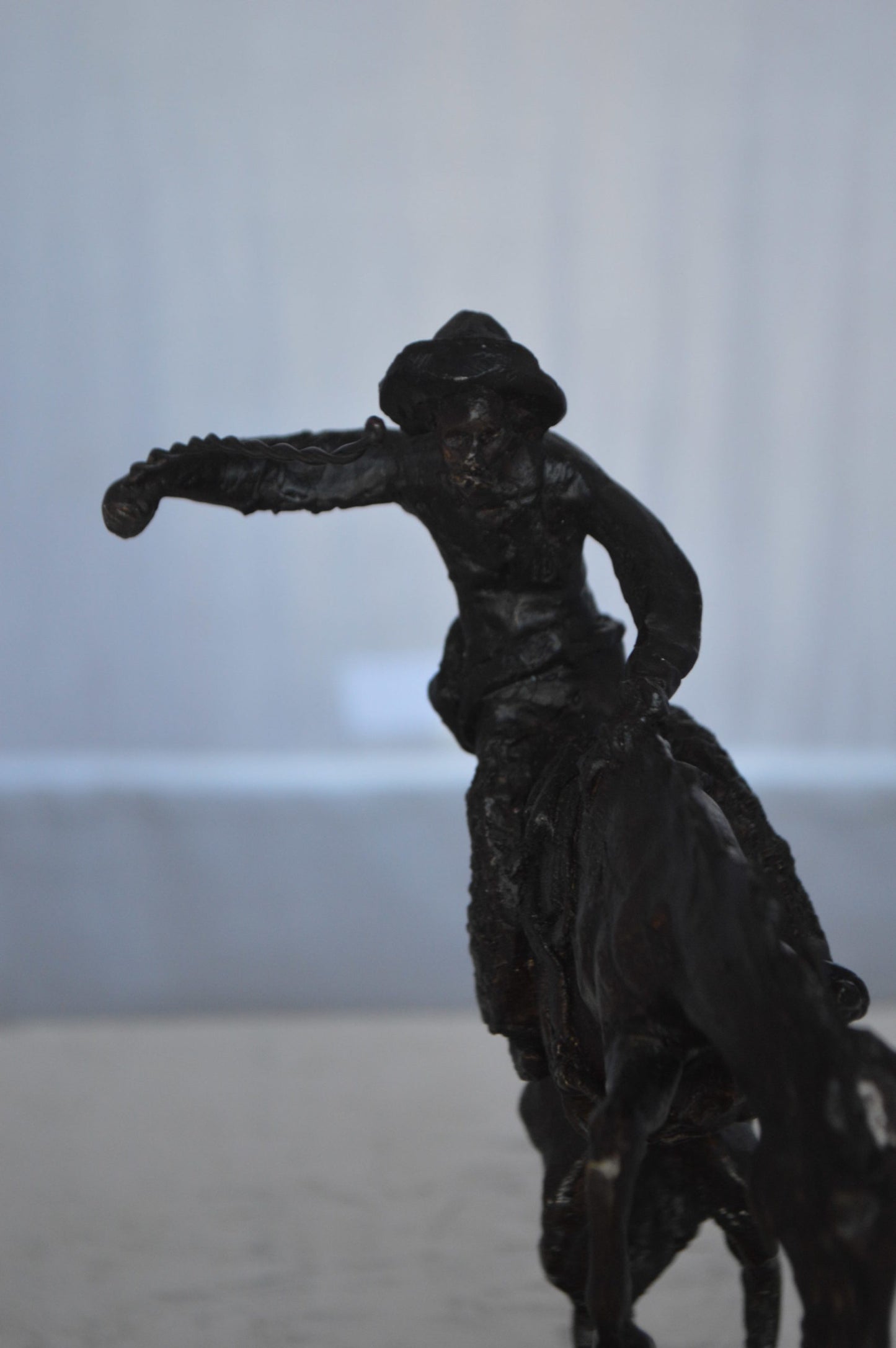 Wooly Chaps Bronze Statue by Remington 13H -  Size: 8"L x 3"W x 9"H.