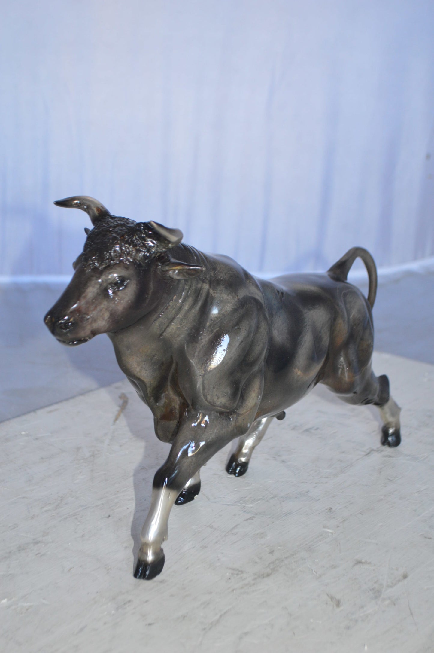 Trotting Bull Bronze Statue -  Size: 13"L x 3"W x 10"H.