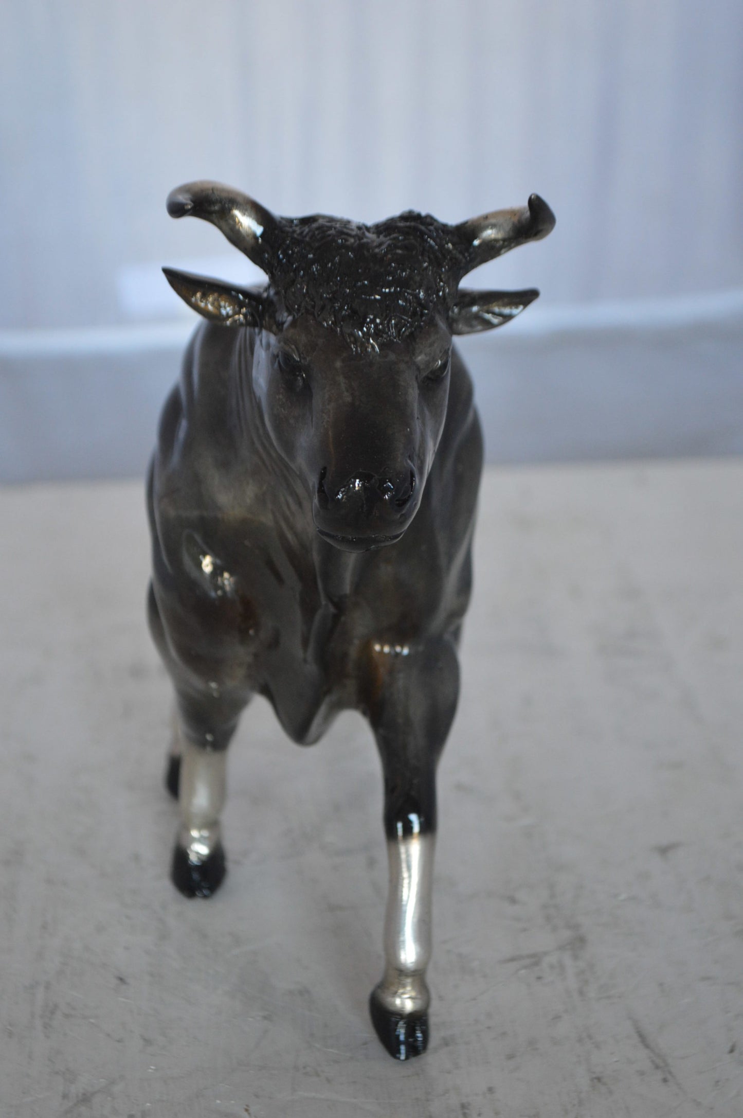 Trotting Bull Bronze Statue -  Size: 13"L x 3"W x 10"H.
