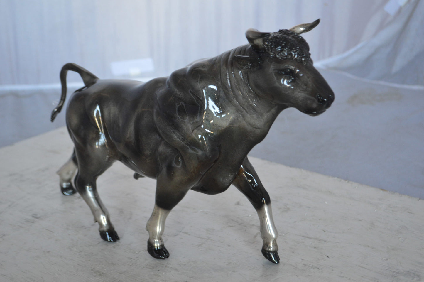 Trotting Bull Bronze Statue -  Size: 13"L x 3"W x 10"H.