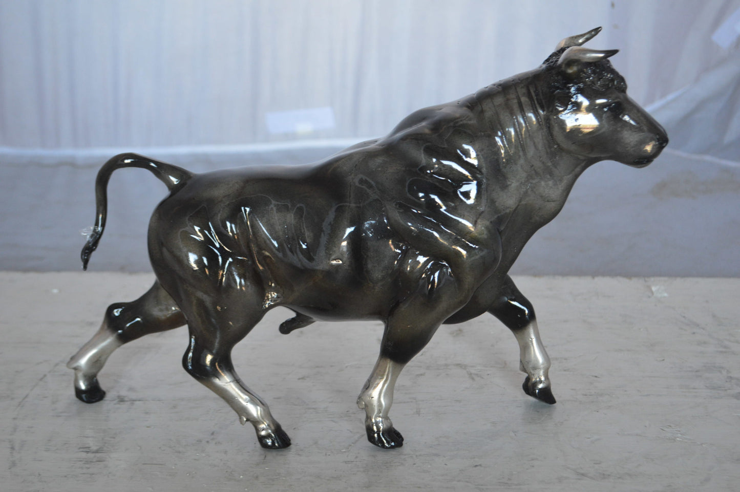 Trotting Bull Bronze Statue -  Size: 13"L x 3"W x 10"H.