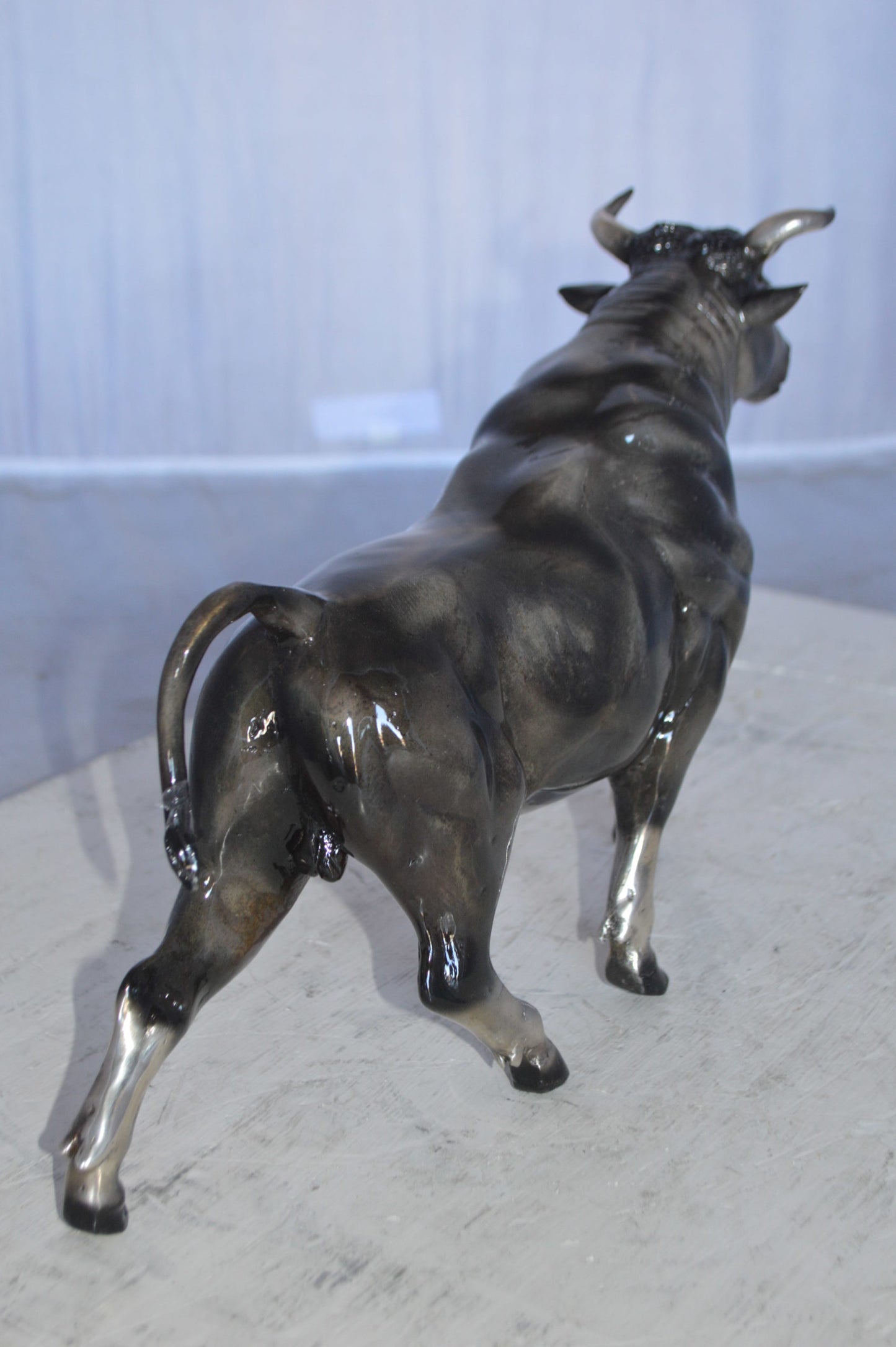 Trotting Bull Bronze Statue -  Size: 13"L x 3"W x 10"H.