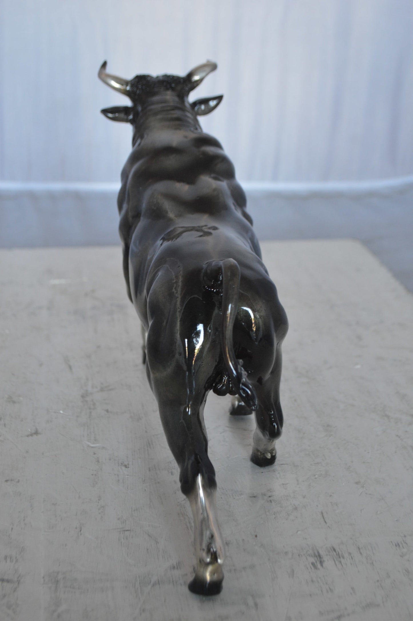Trotting Bull Bronze Statue -  Size: 13"L x 3"W x 10"H.