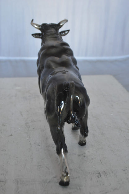 Trotting Bull Bronze Statue -  Size: 13"L x 3"W x 10"H.