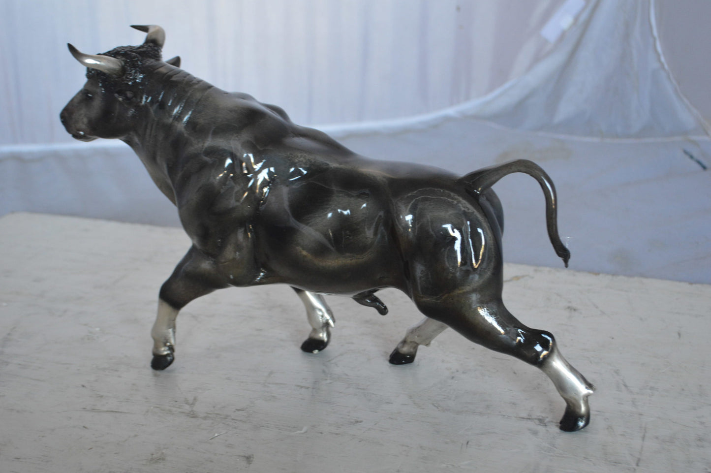 Trotting Bull Bronze Statue -  Size: 13"L x 3"W x 10"H.