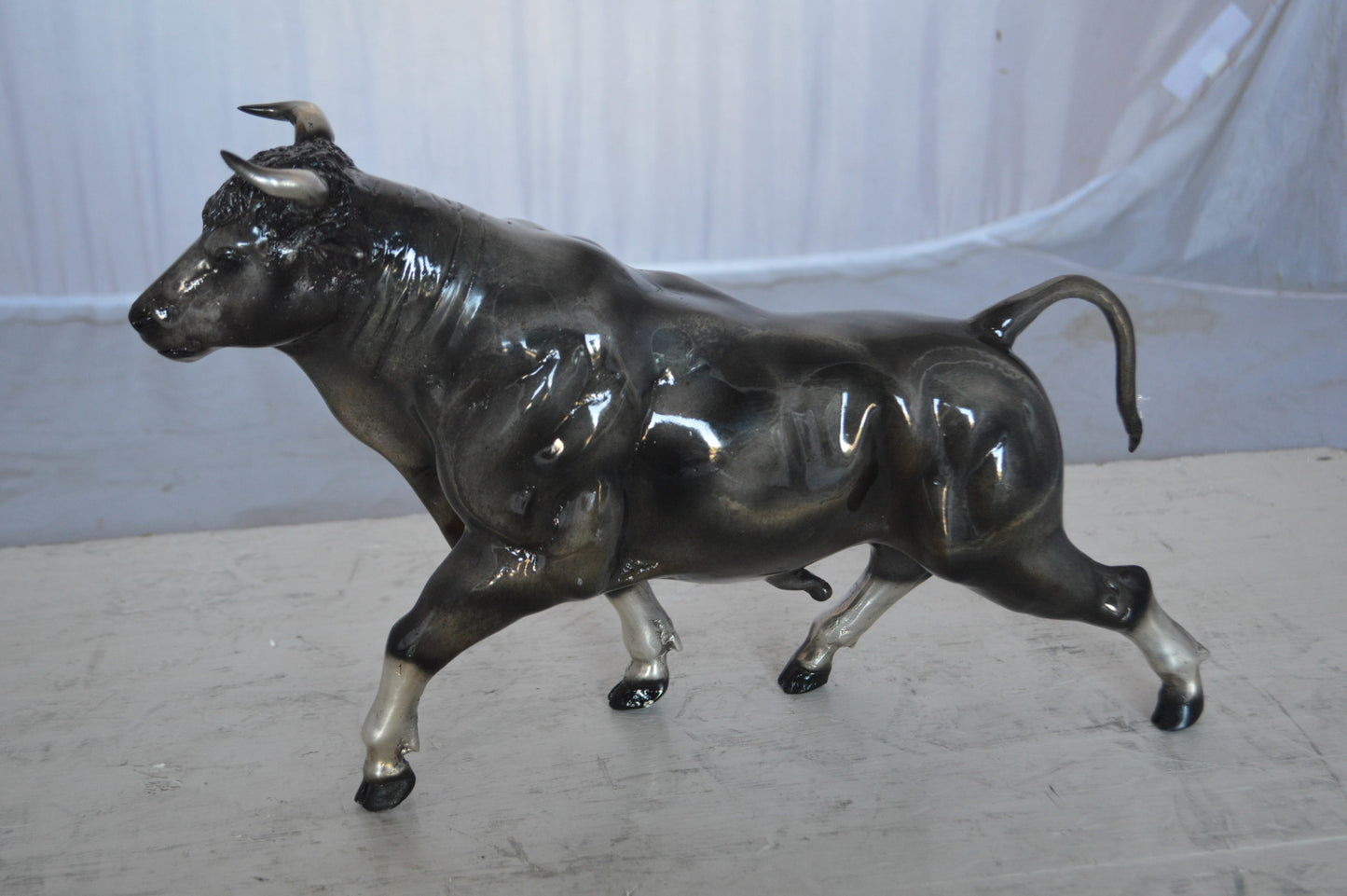 Trotting Bull Bronze Statue -  Size: 13"L x 3"W x 10"H.