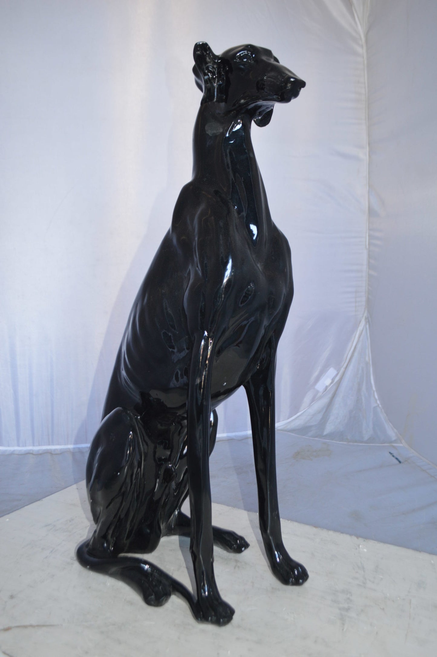Greyhound Dog statue made of resin -  Size: 12"L x 9"W x 31"H.
