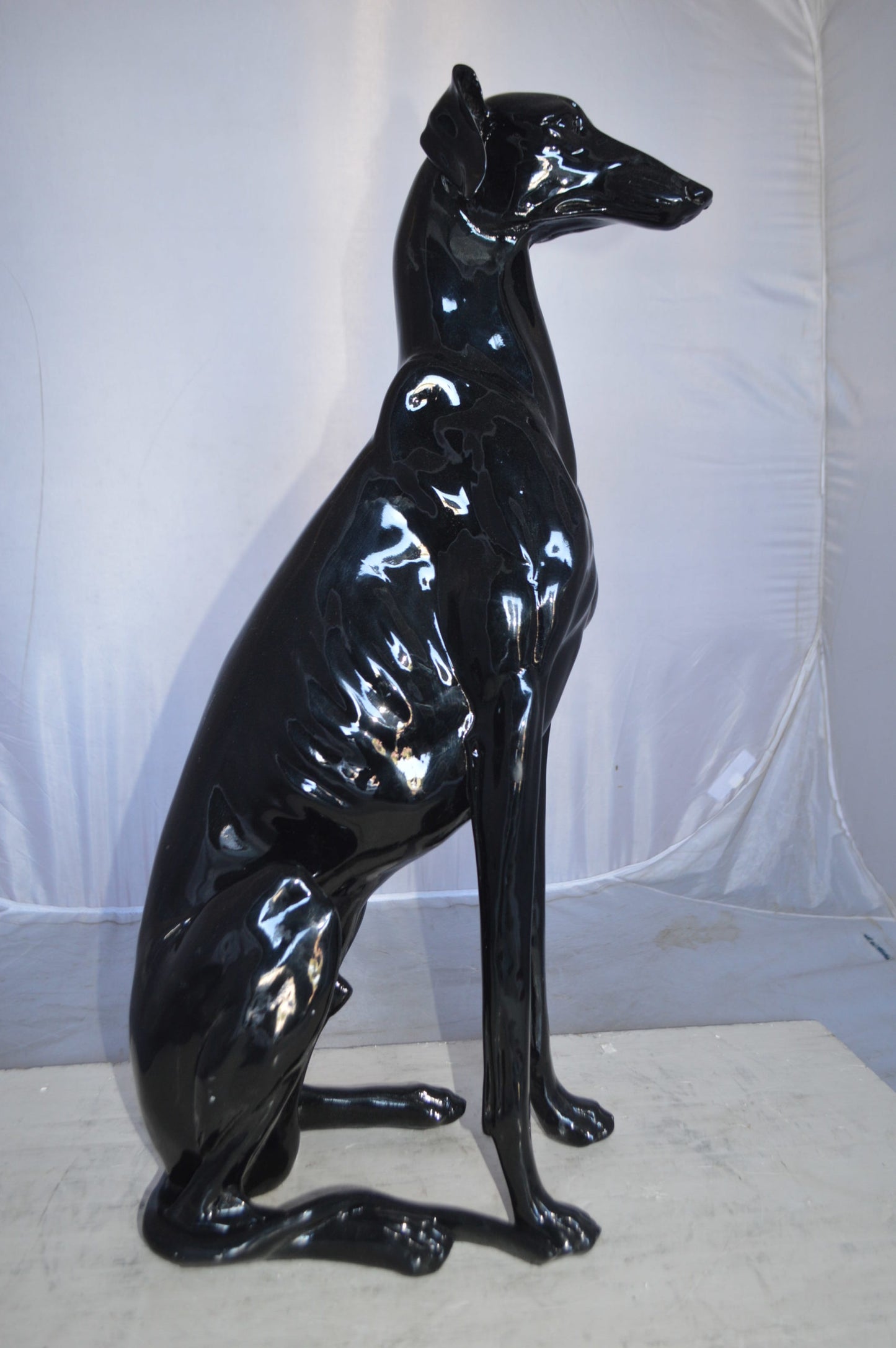 Greyhound Dog statue made of resin -  Size: 12"L x 9"W x 31"H.