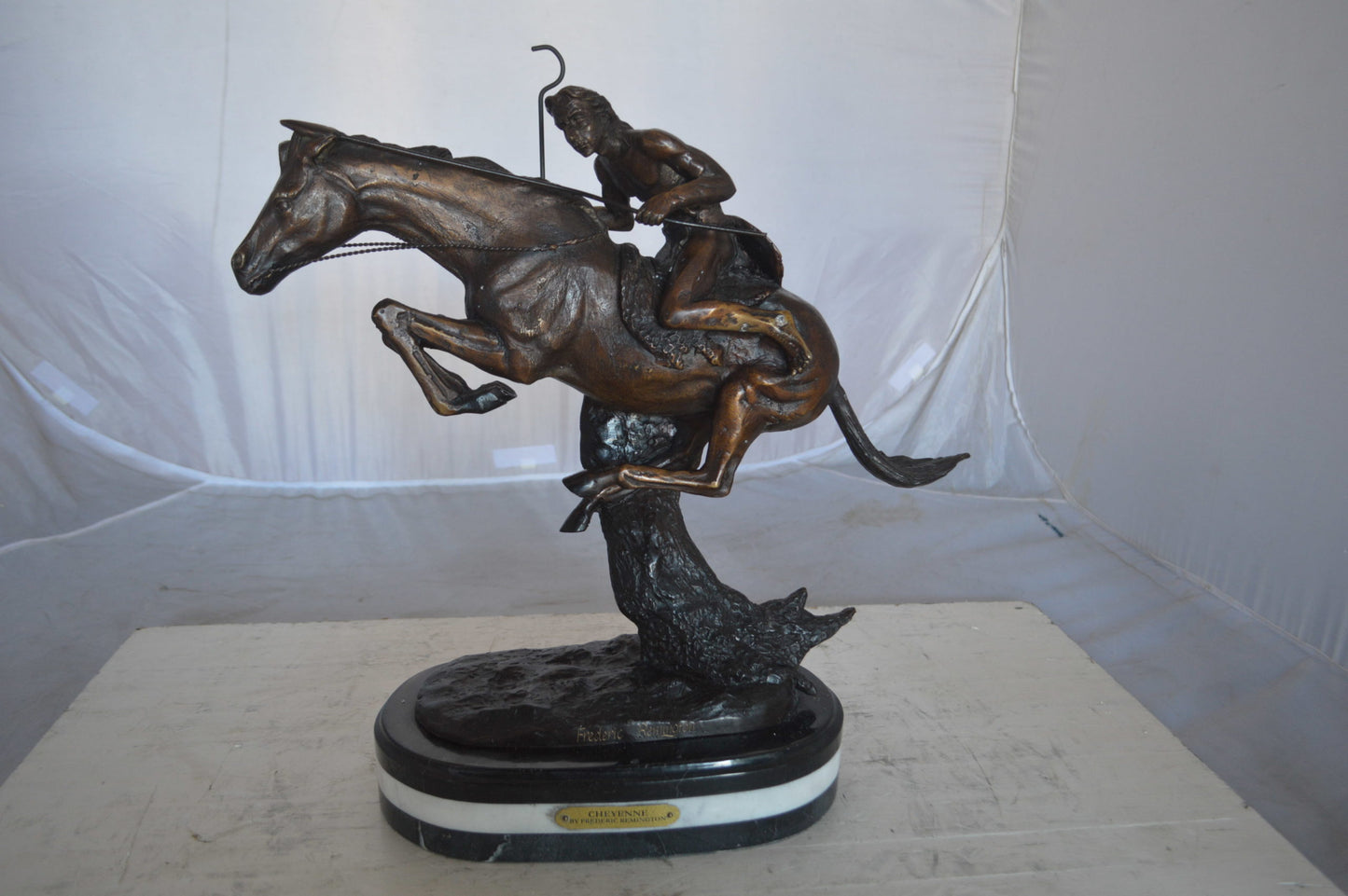 Cheyenne by Remington Bronze Statue replica  -  Size: 12"L x 7"W x 19"H.