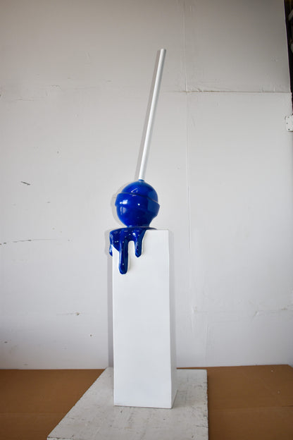 Blue Lollipop Mounted on A White Pedestal Resin Statue Size: 10" x 10" x 59"H