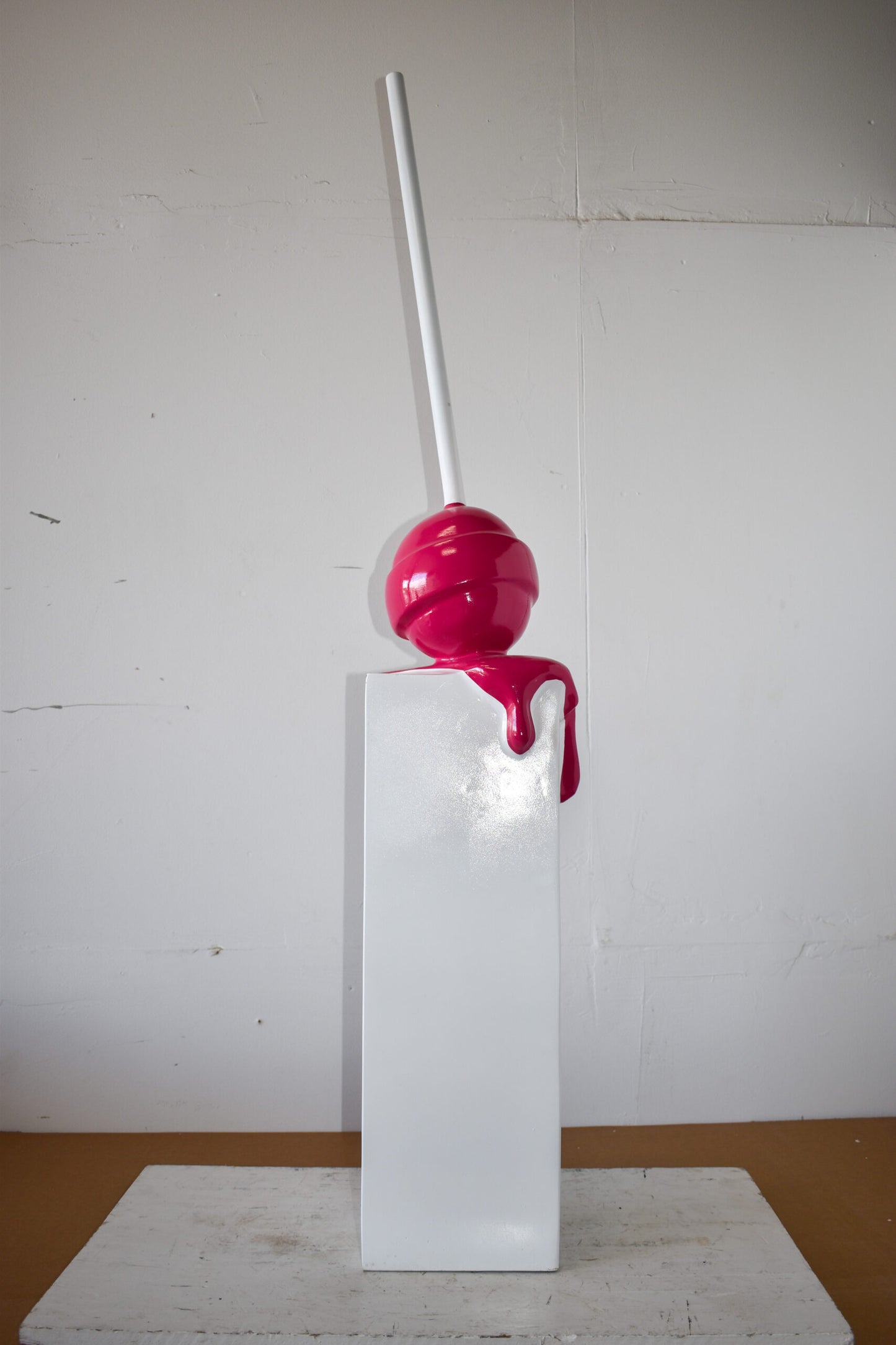 Red Lollipop Mounted on A White Pedestal Resin Statue Size: 10" x 10" x 59"H