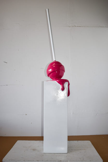 Red Lollipop Mounted on A White Pedestal Resin Statue Size: 10" x 10" x 59"H