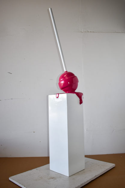Red Lollipop Mounted on A White Pedestal Resin Statue Size: 10" x 10" x 59"H