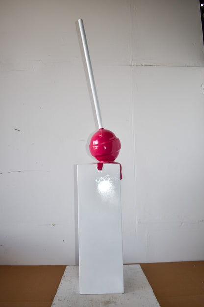 Red Lollipop Mounted on A White Pedestal Resin Statue Size: 10" x 10" x 59"H