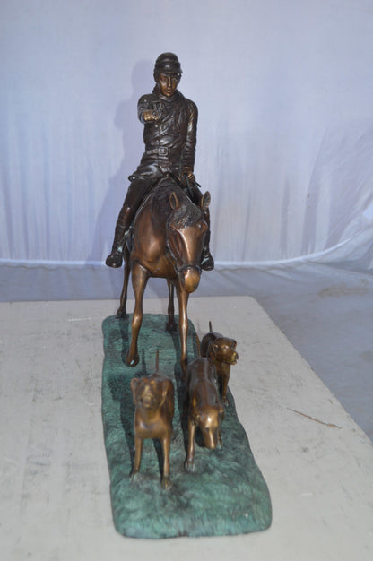 Hunter with three dogs Bronze Statue -  Size: 27"L x 6"W x 18"H.