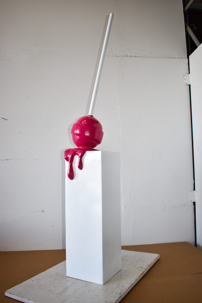 Red Lollipop Mounted on A White Pedestal Resin Statue Size: 10" x 10" x 59"H