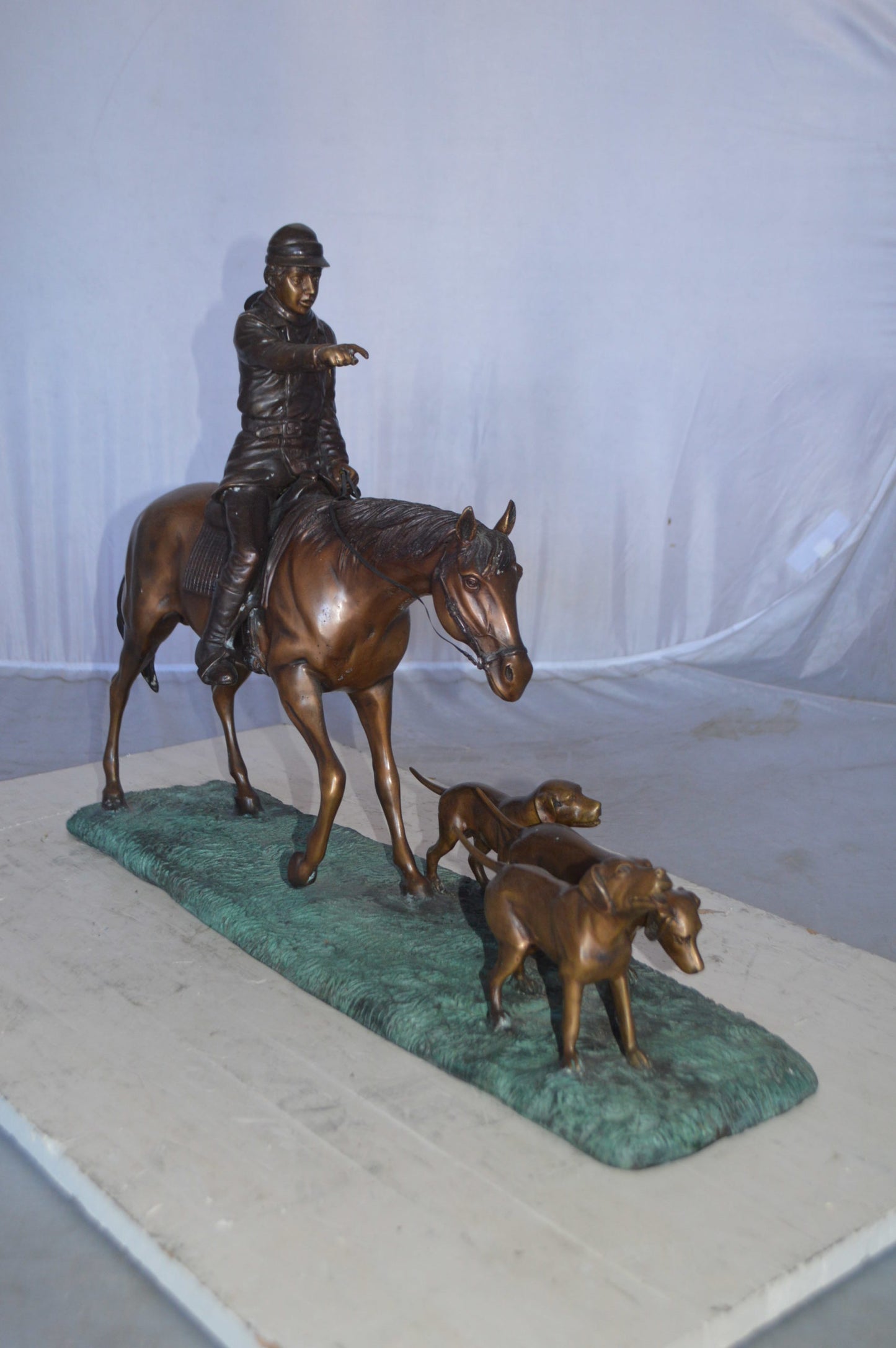 Hunter with three dogs Bronze Statue -  Size: 27"L x 6"W x 18"H.