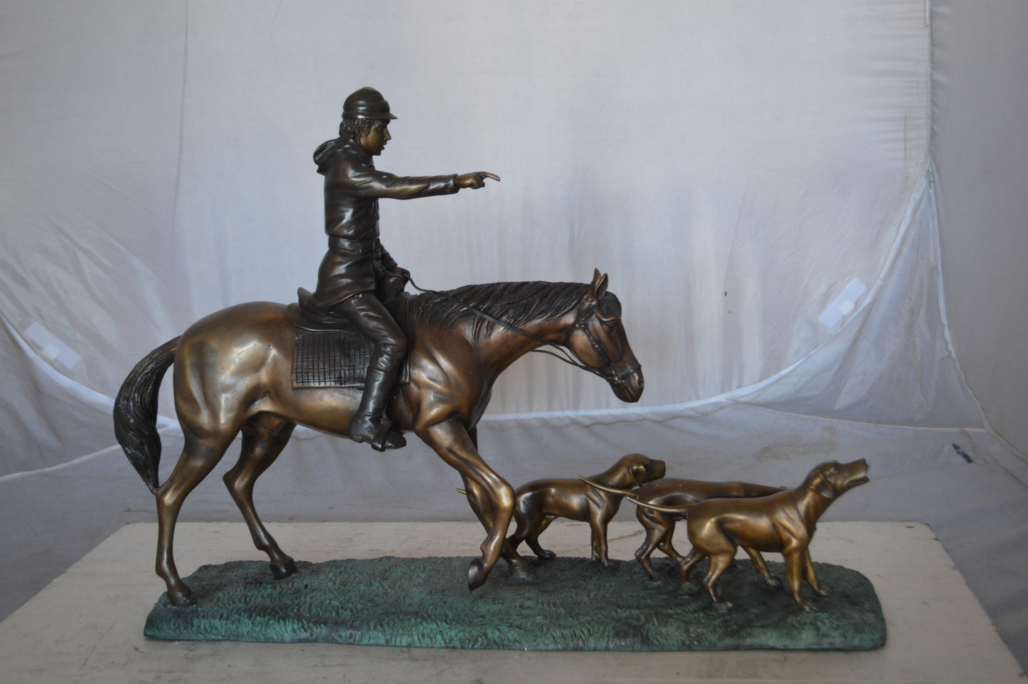 Hunter with three dogs Bronze Statue -  Size: 27"L x 6"W x 18"H.