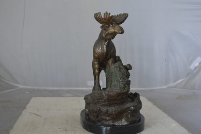 Moose on a rock bronze statue - Size: 9"L x 7"W x 14"H.