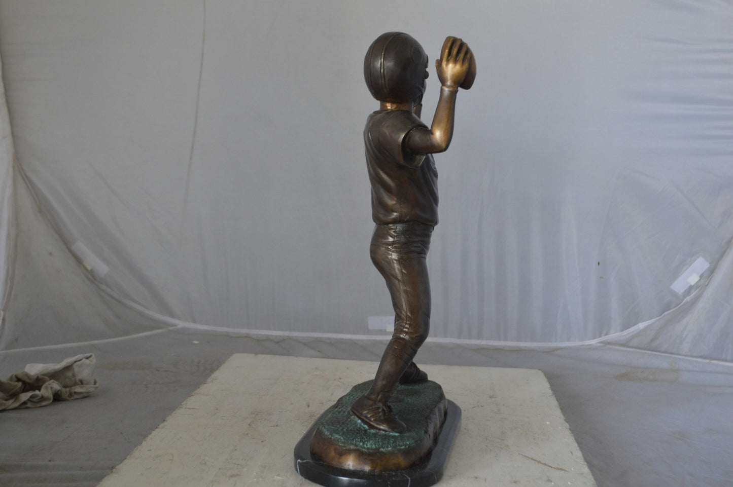 Young Quarterback bronze statue - Size: 14"L x 6"W x 20"H.