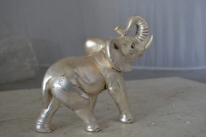 Elephant statue made of resin - Size: 9"L x 4"W x 8"H.