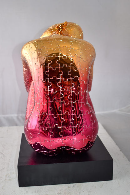 Puzzle Patterned Cradled Woman Resin Statue on Black Base Size: 13" x 12" x 19"H