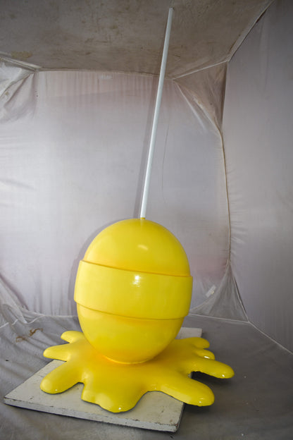 Giant Yellow Lollipop Melted on The Ground Resin Statue Size: 31" x 27" x 56"H