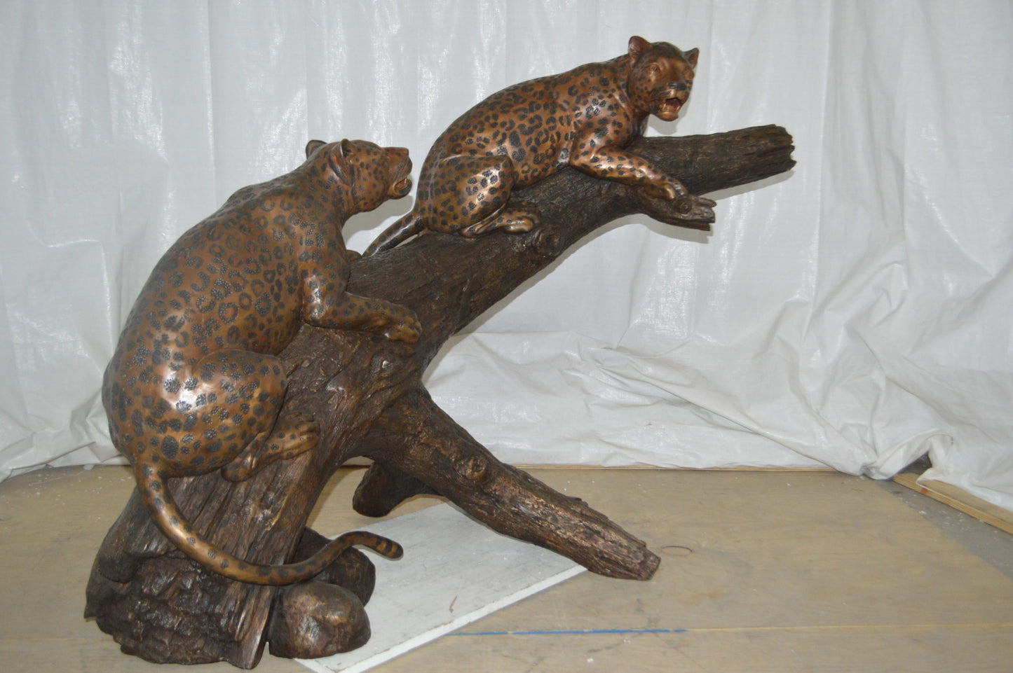 Two Jaguars On A Tree Bronze Statue - Size: 66"L x 34"W x 44"H.