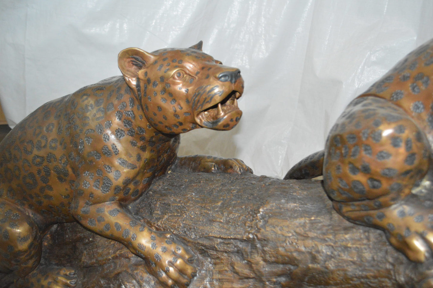 Two Jaguars On A Tree Bronze Statue - Size: 66"L x 34"W x 44"H.
