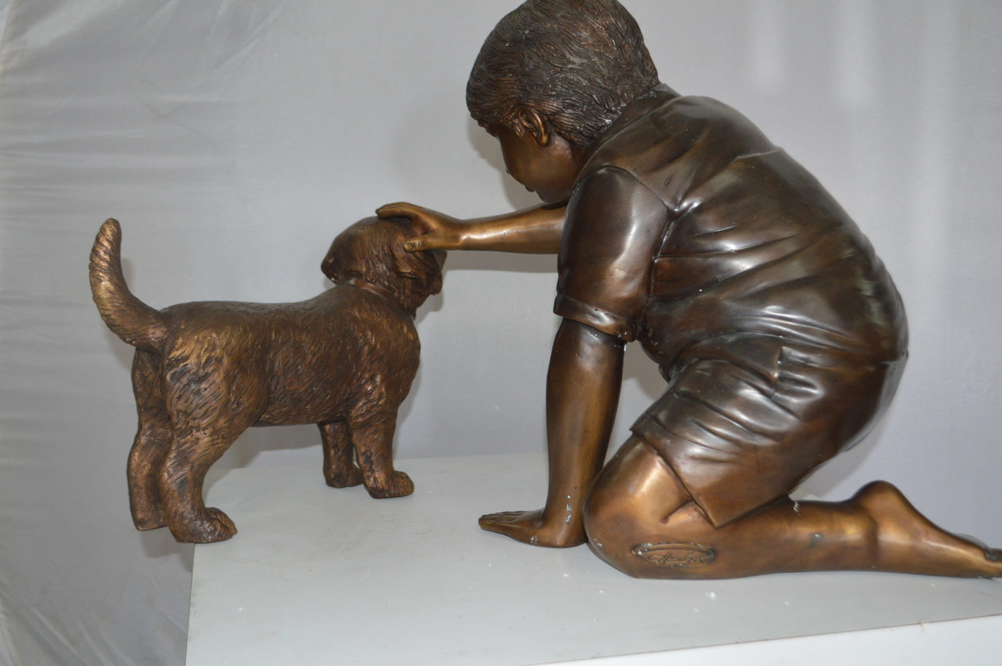 Boy and Dog Bronze Statue - Size: 30"L x 18"W x 18"H.