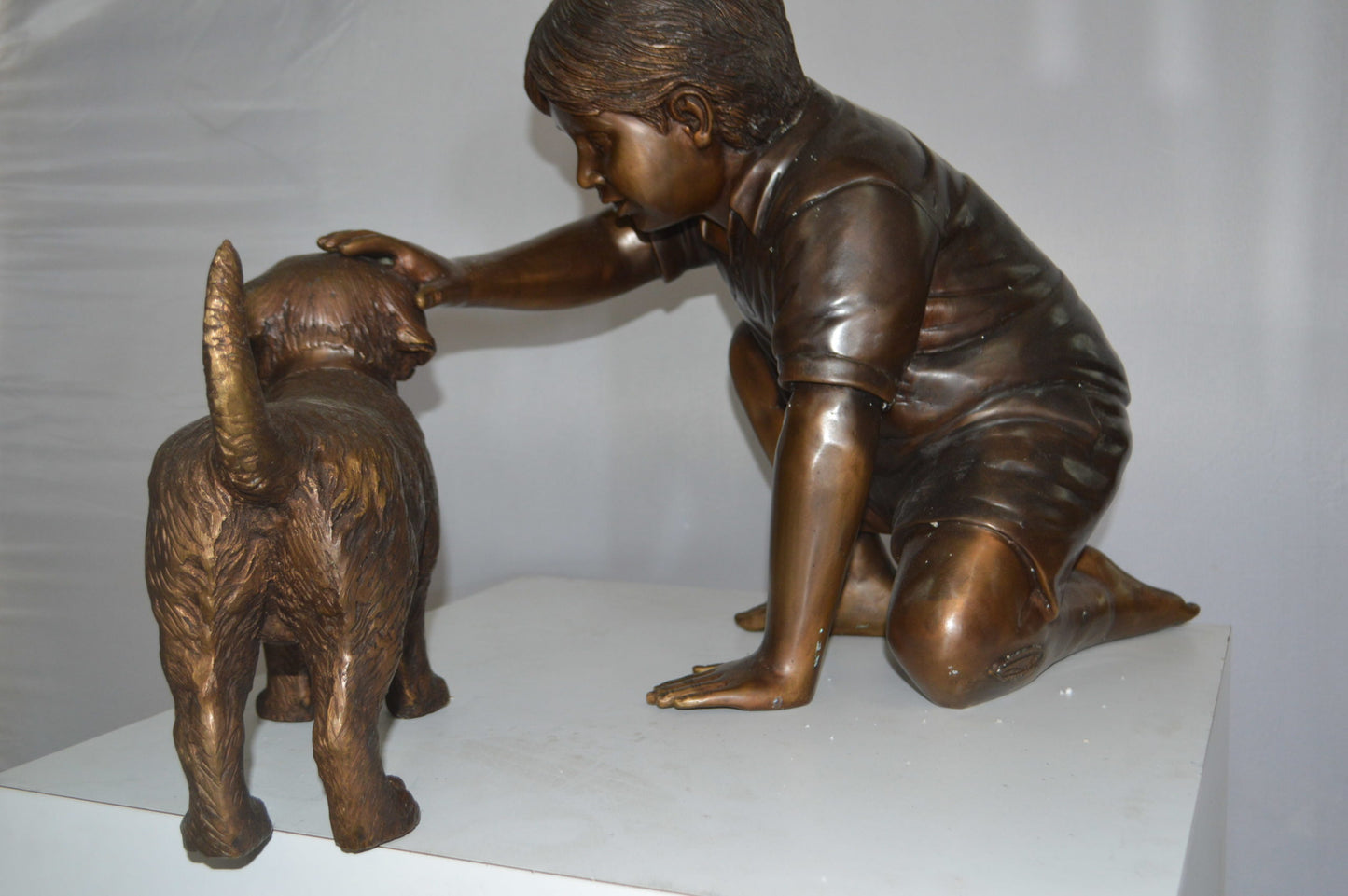 Boy and Dog Bronze Statue - Size: 30"L x 18"W x 18"H.
