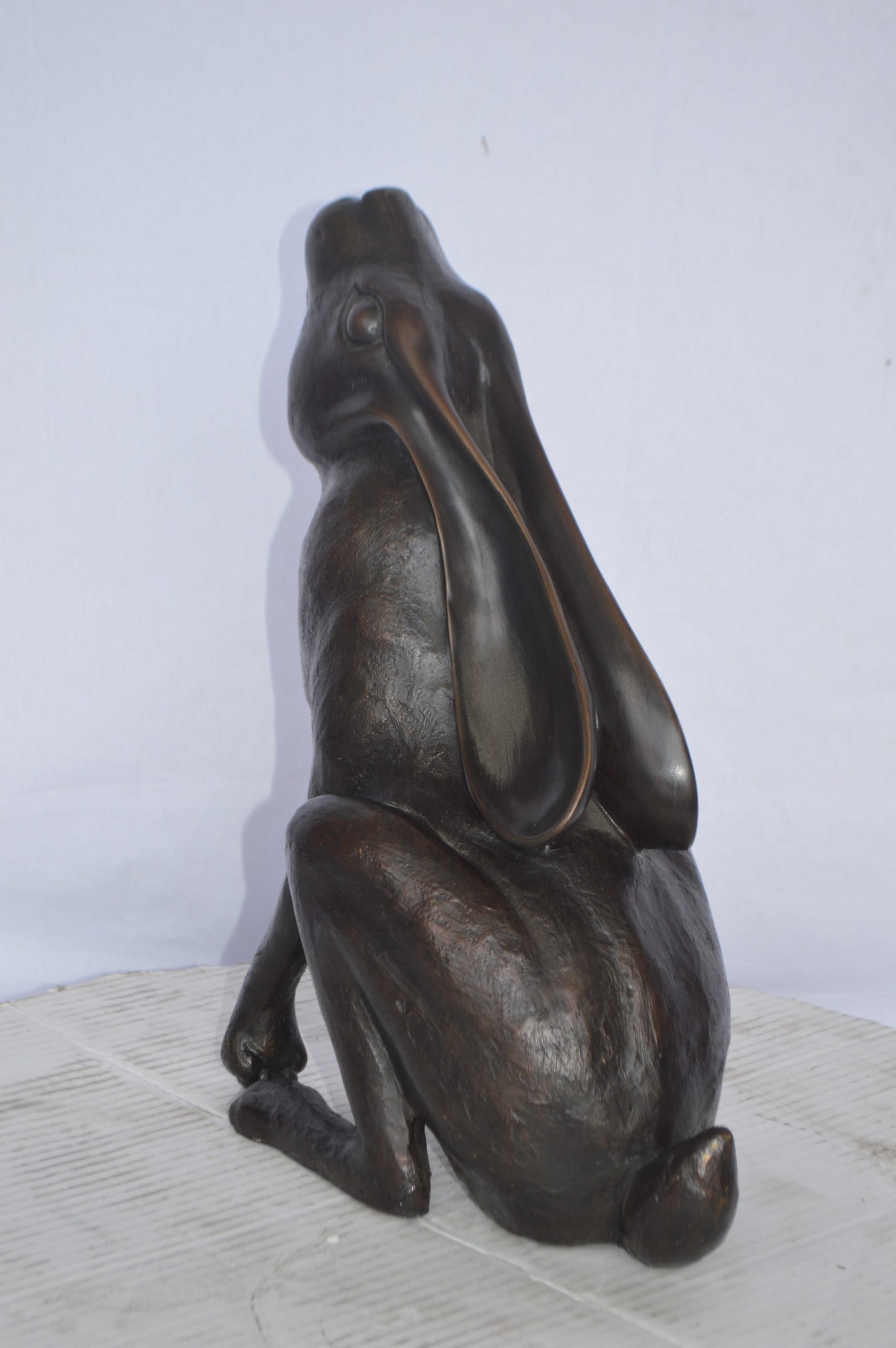 Rabbit Gazing Up Bronze Statue - Size: 8"L x 14"W x 16"H.