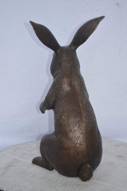 Rabbit looking down bronze statue - Size: 10"L x 12"W x 20"H.