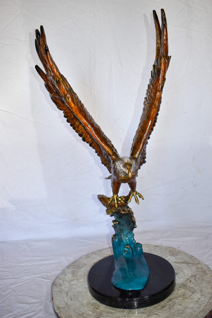 Eagle In Action Catching a Fish from Water Bronze Statue Size: 18" x 17" x 37"H