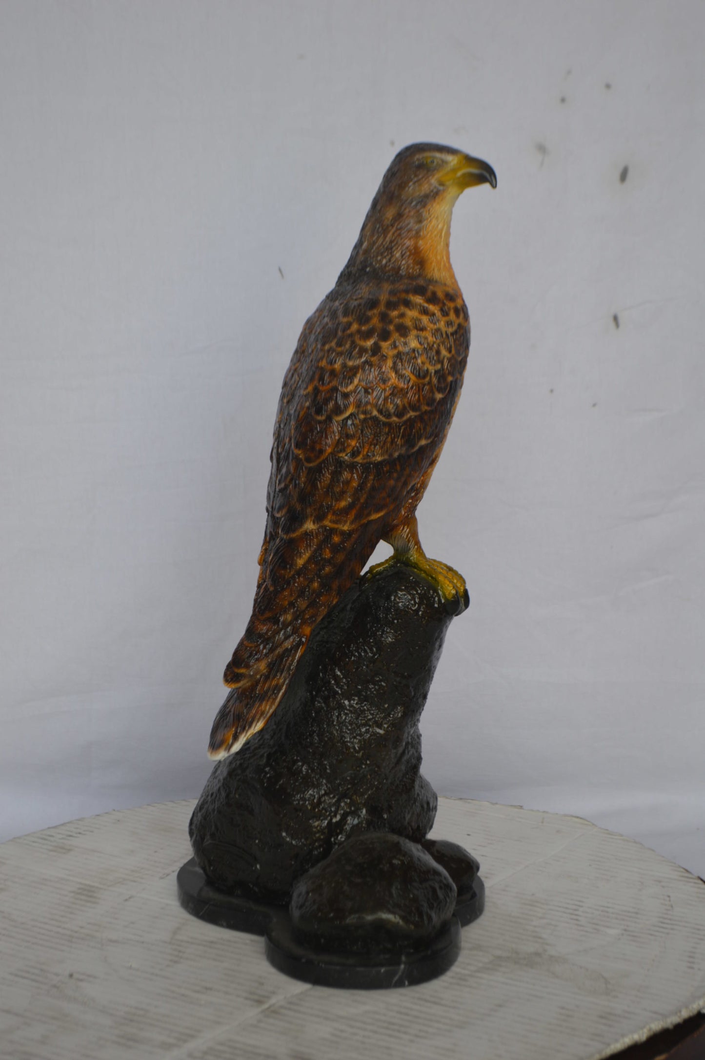 Hawk on a Rock bronze statue - Size: 12"L x 9"W x 22"H.
