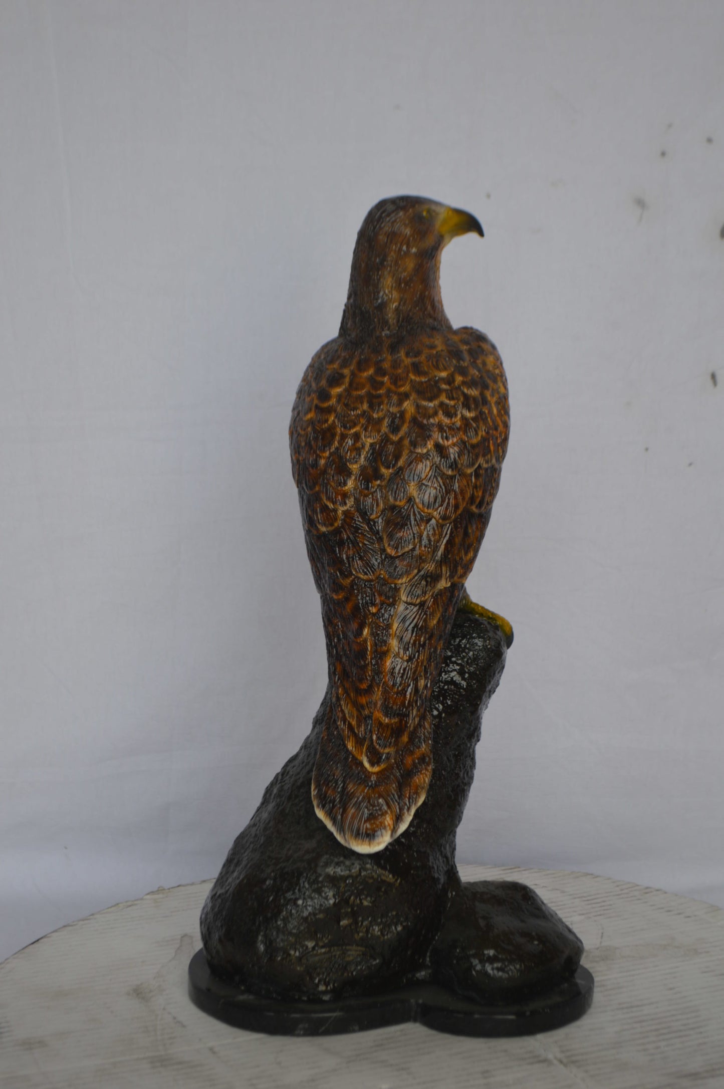 Hawk on a Rock bronze statue - Size: 12"L x 9"W x 22"H.