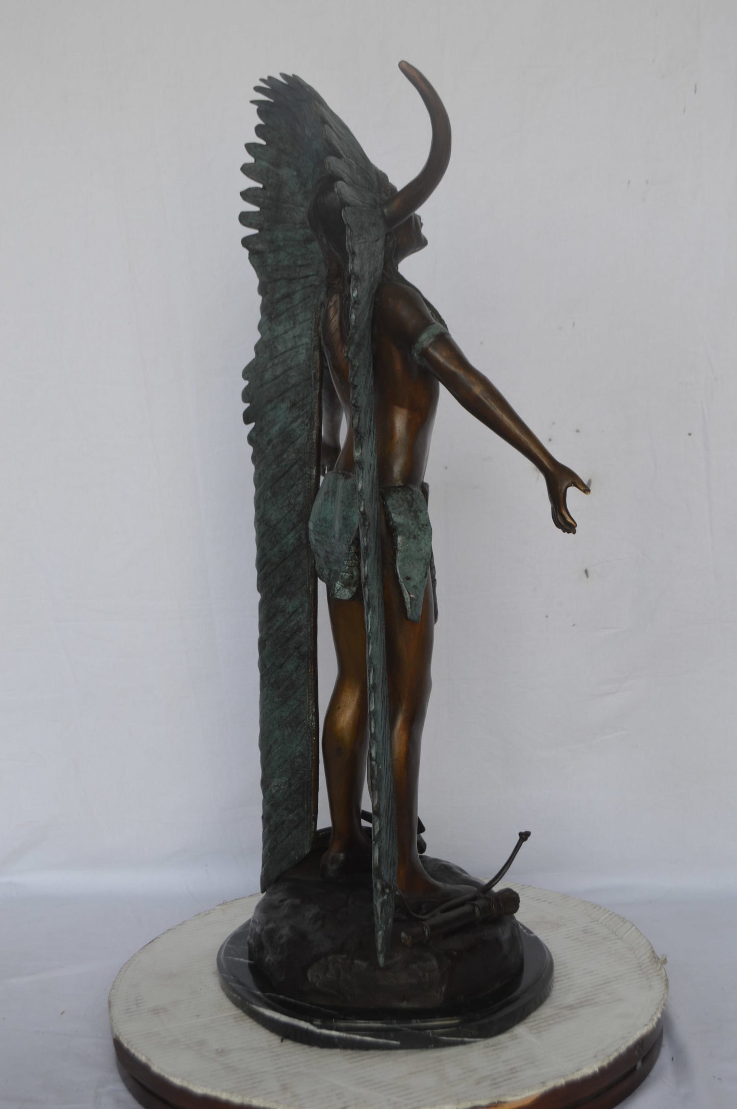Indian with Plume bronze statue - Size: 22"L x 14"W x 38"H.