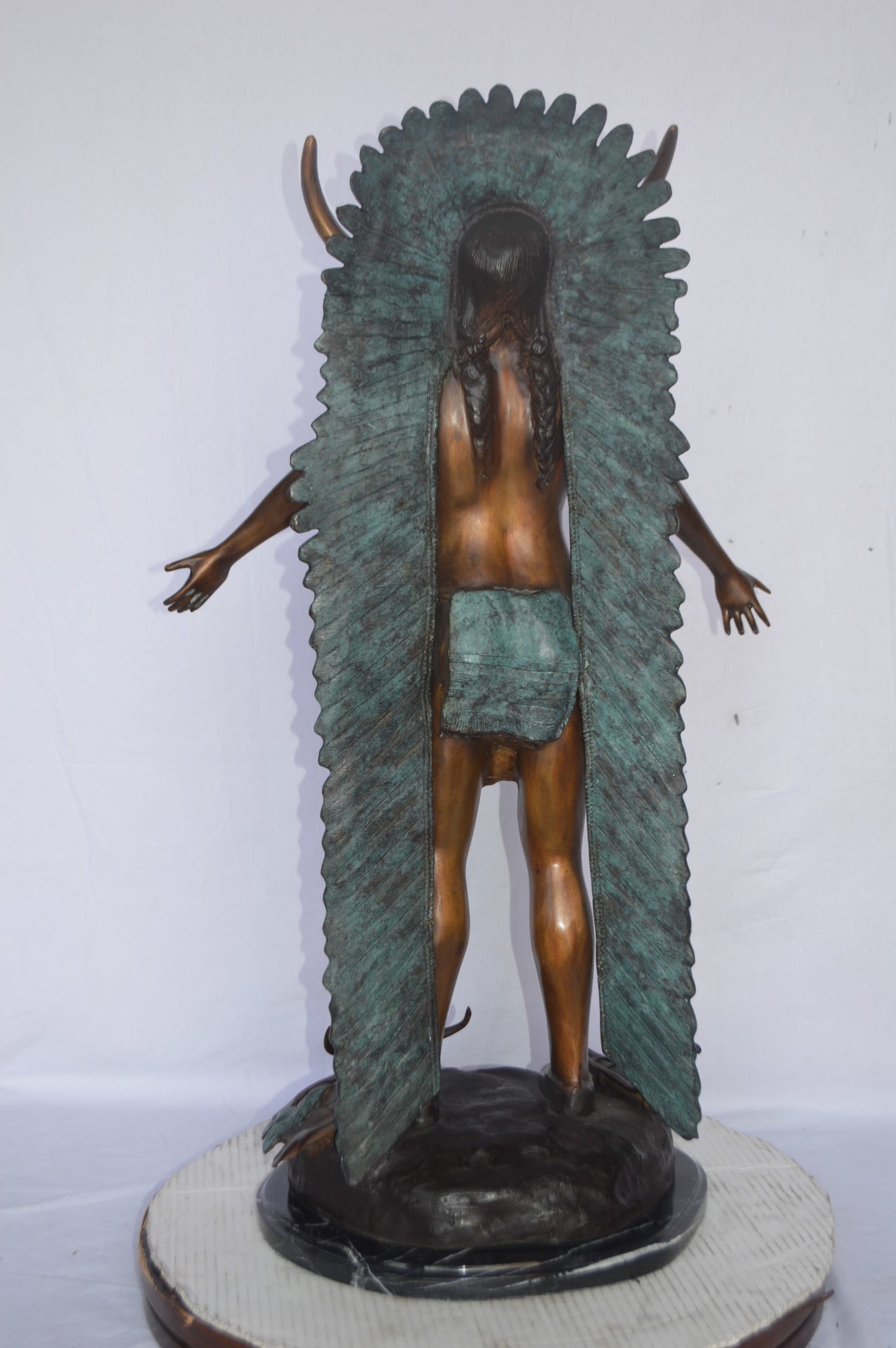 Indian with Plume bronze statue - Size: 22"L x 14"W x 38"H.