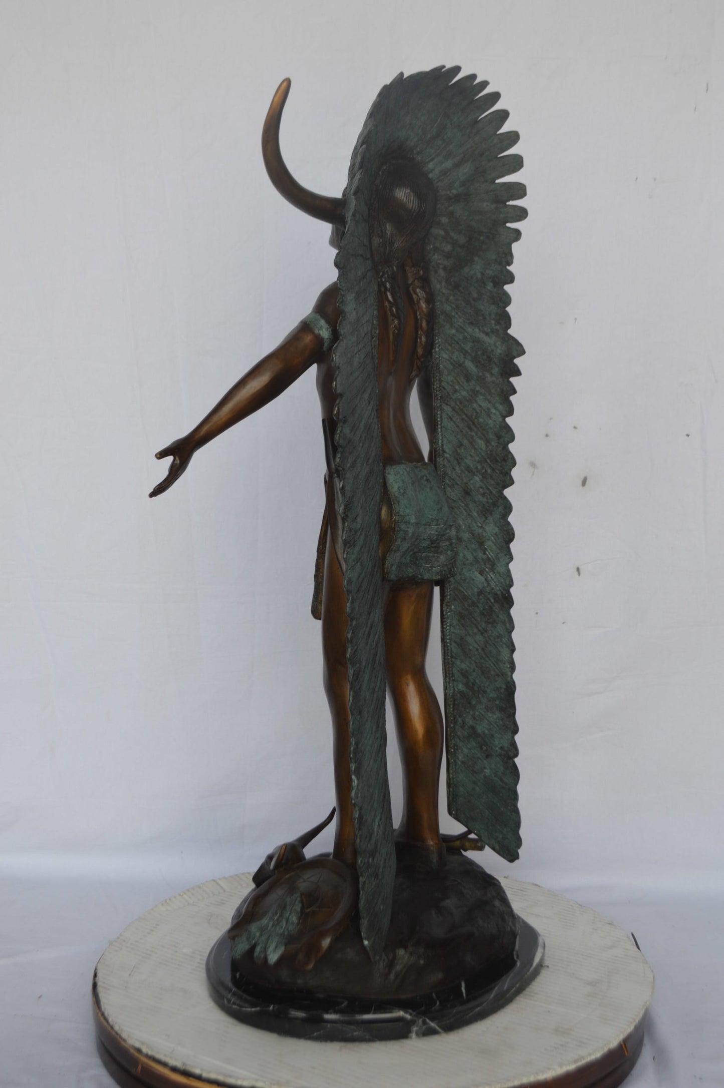 Indian with Plume bronze statue - Size: 22"L x 14"W x 38"H.
